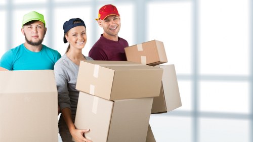 Mover assessing lifting risks before handling furniture