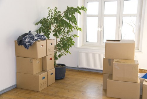 Removal team preparing a Kennington home move with boxes and furniture