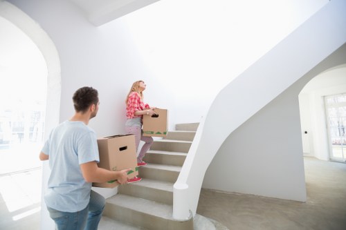 Careful packing of fragile household items in Kennington