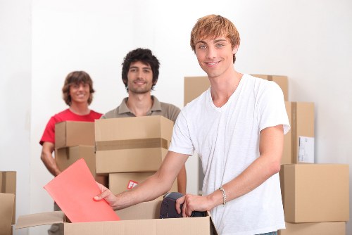 Boxes and furniture being loaded for an urgent local removal